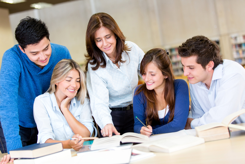 Group of young people studying at the library