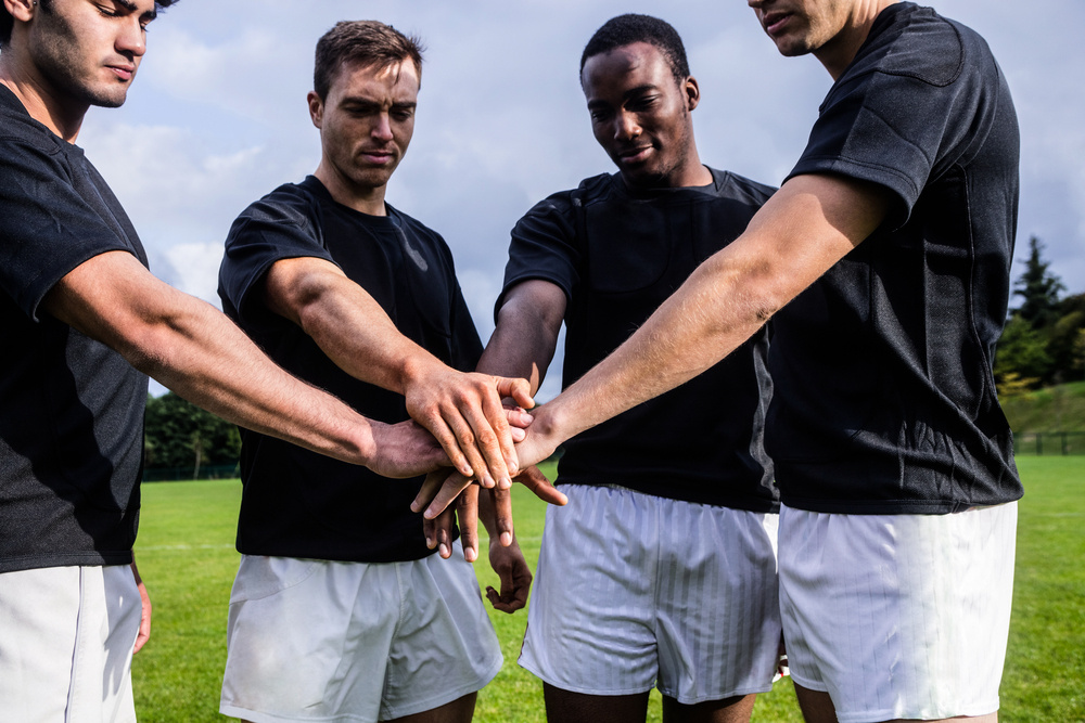 Rugby players standing together before match at the park